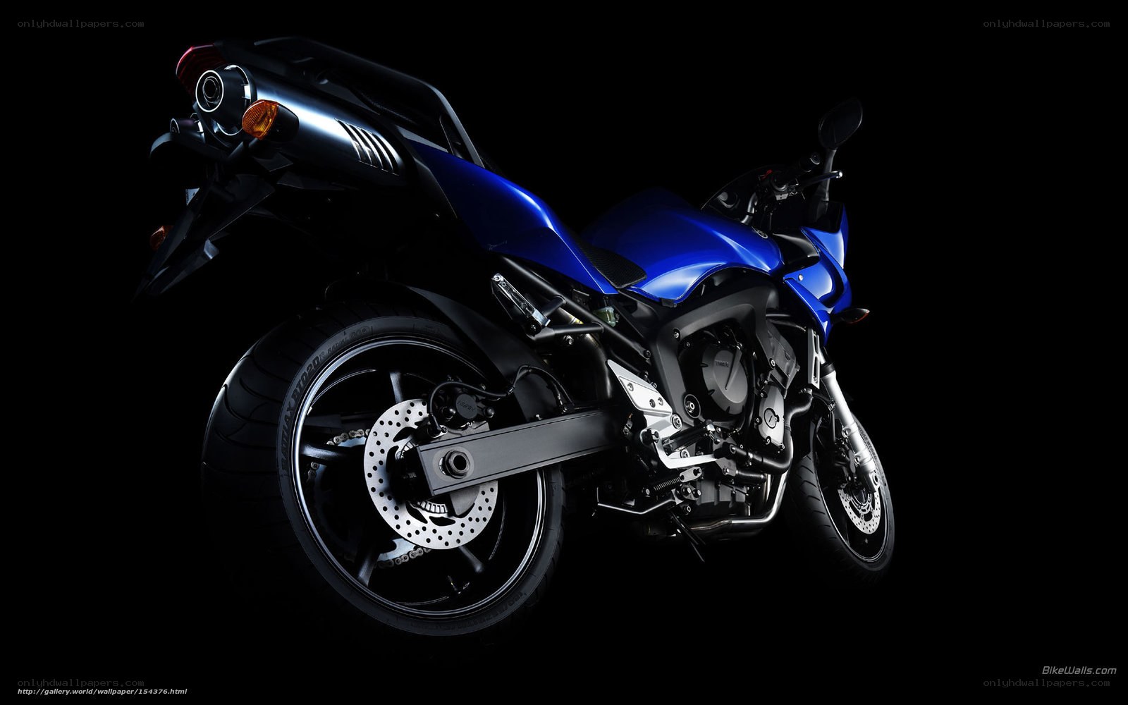 blue motorcycle on black background