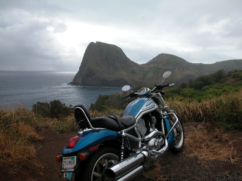 Blue Motorcycle on Cliff — Dramatic
