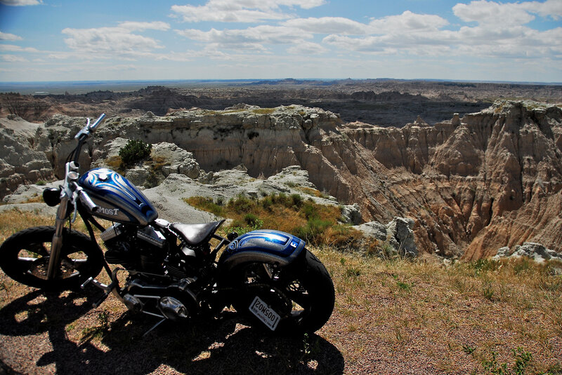 Blue Motorcycle on Cliff