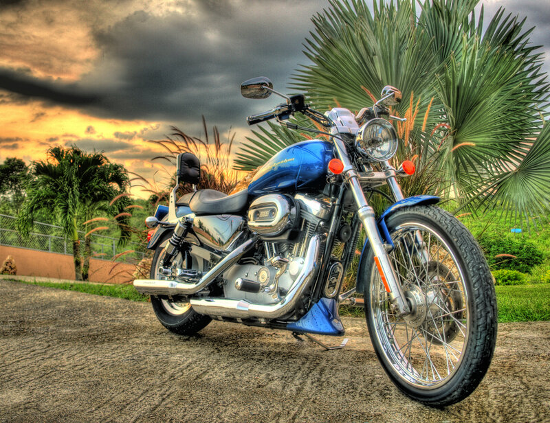 Blue Motorcycle on Pavement