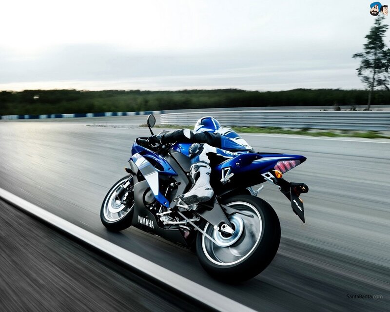 blue motorcycle on racetrack