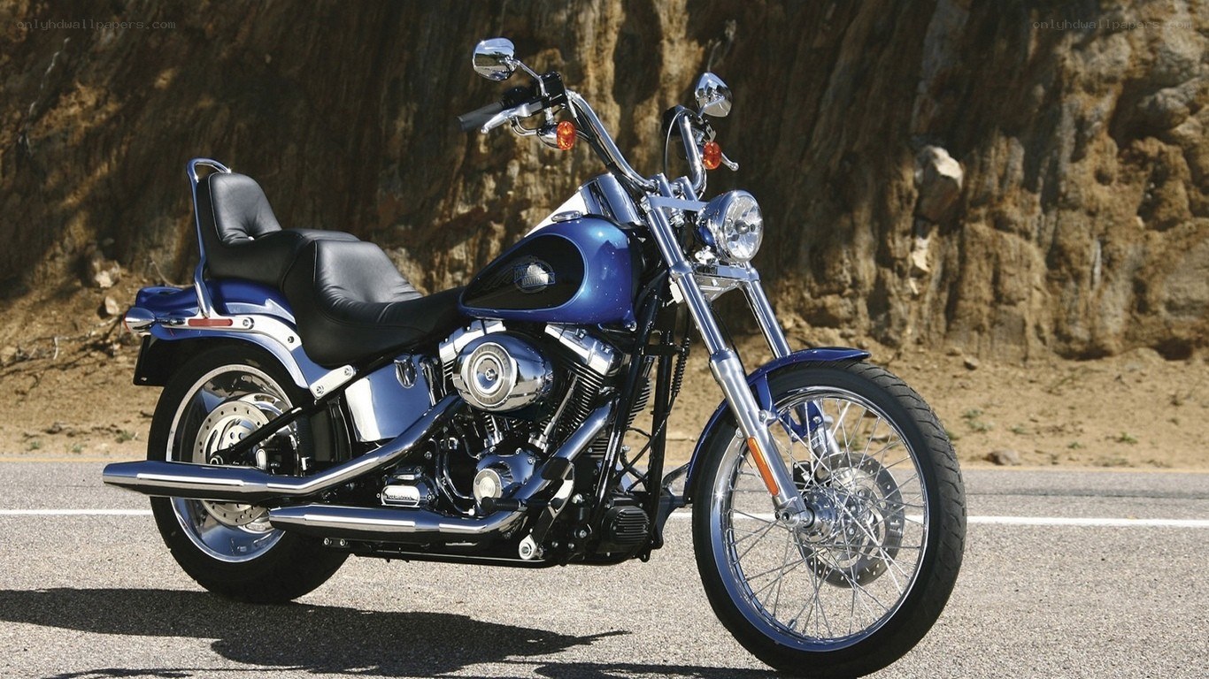 blue motorcycle on road