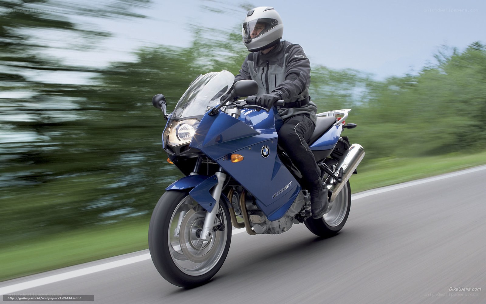 blue motorcycle on road