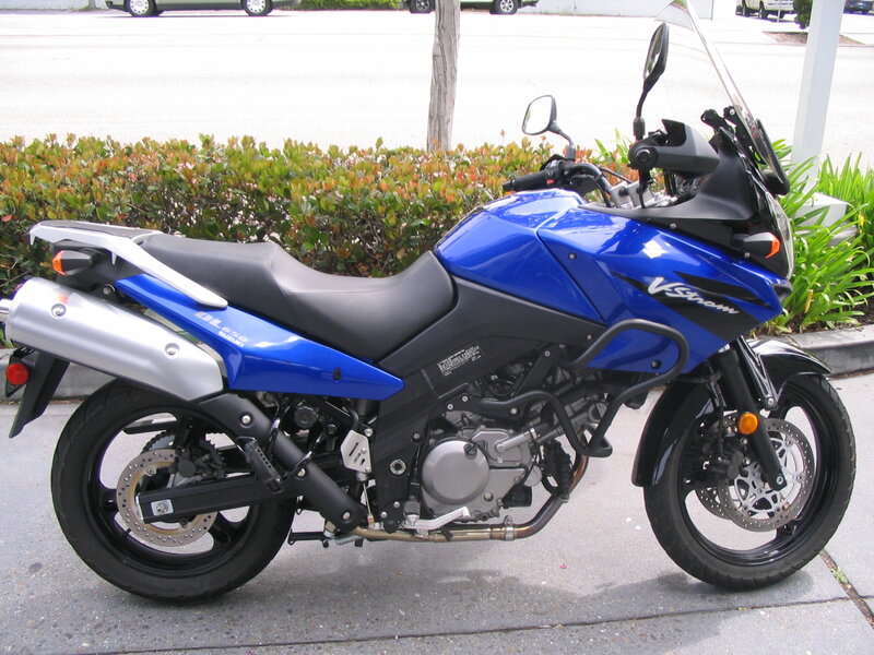 Blue Motorcycle on Sidewalk