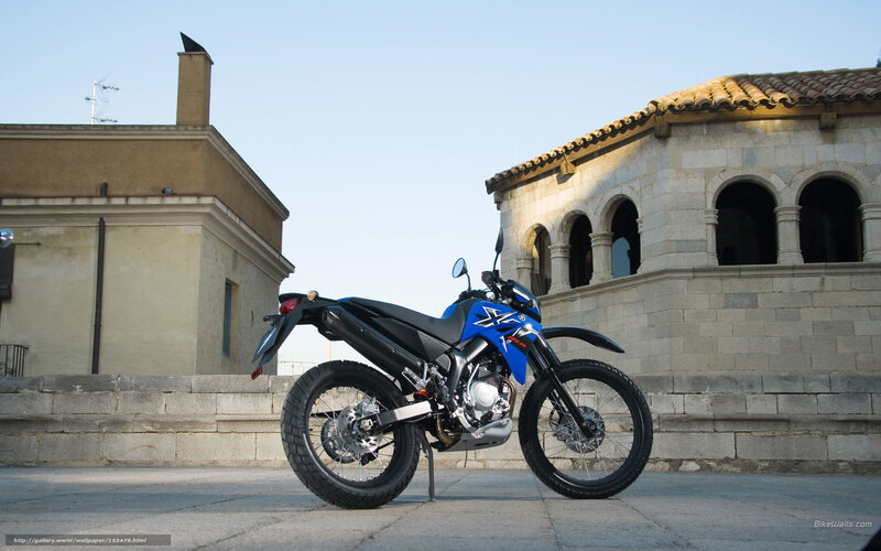 Blue motorcycle on stone pavement