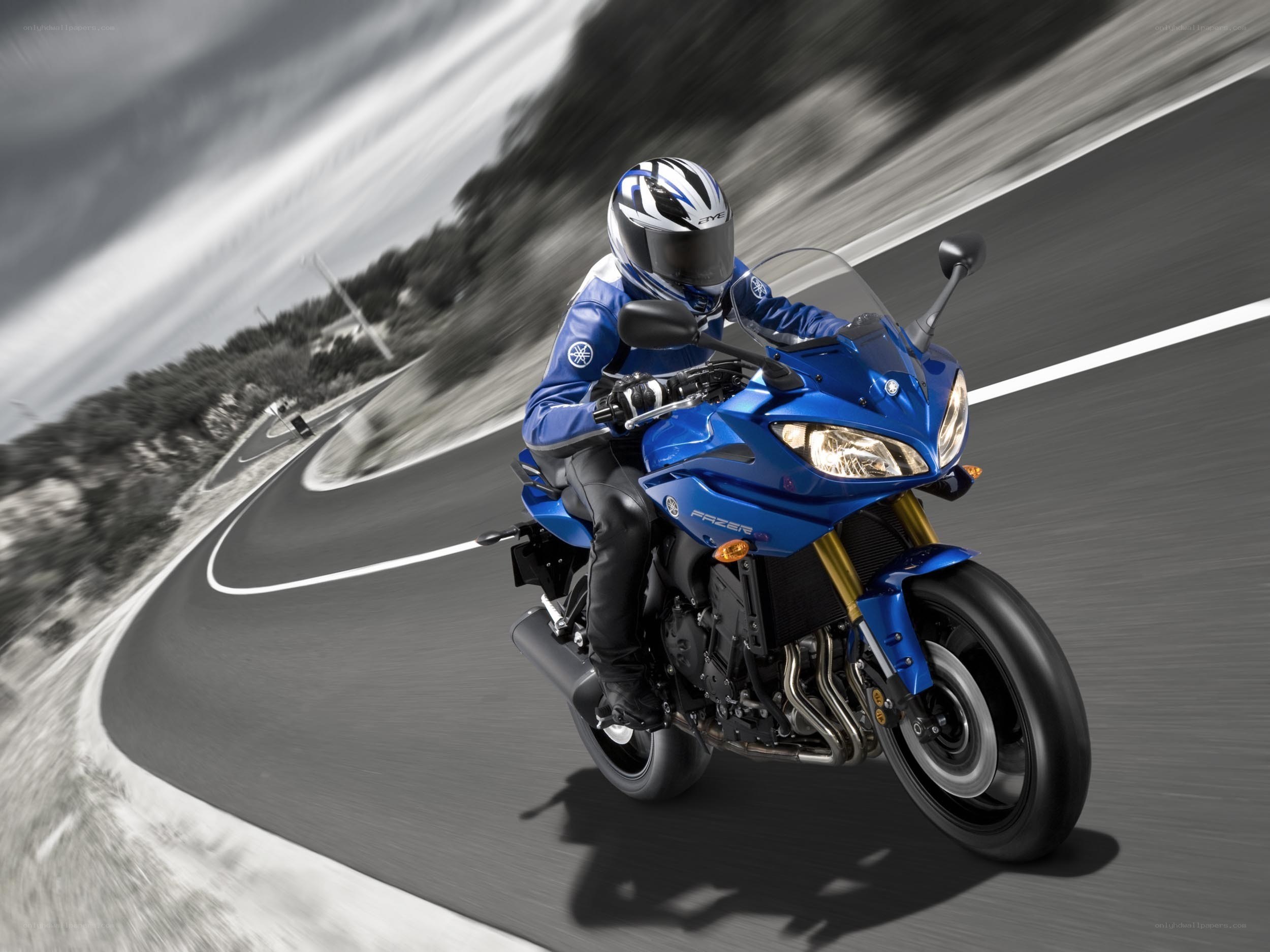 Blue motorcycle on winding road
