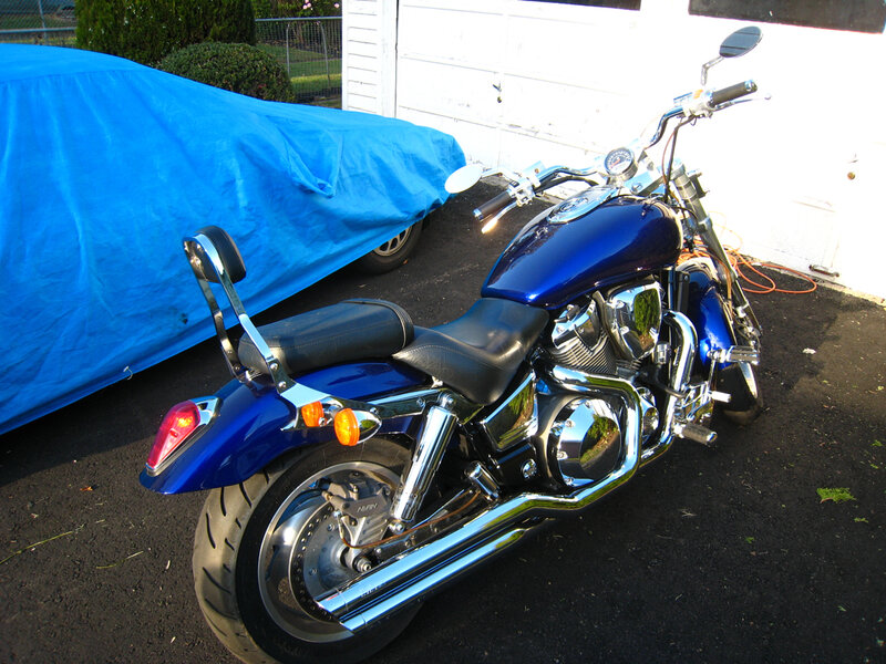 Blue motorcycle parked outside