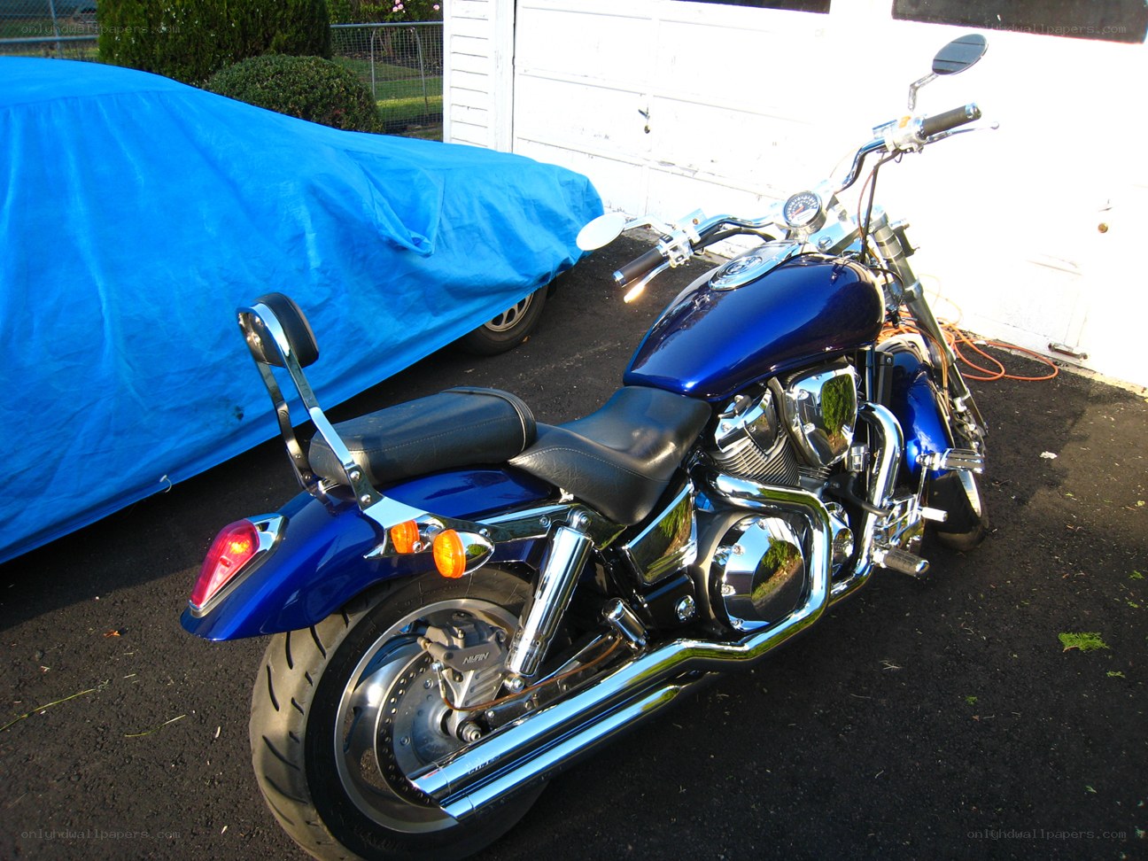 Blue motorcycle parked outside