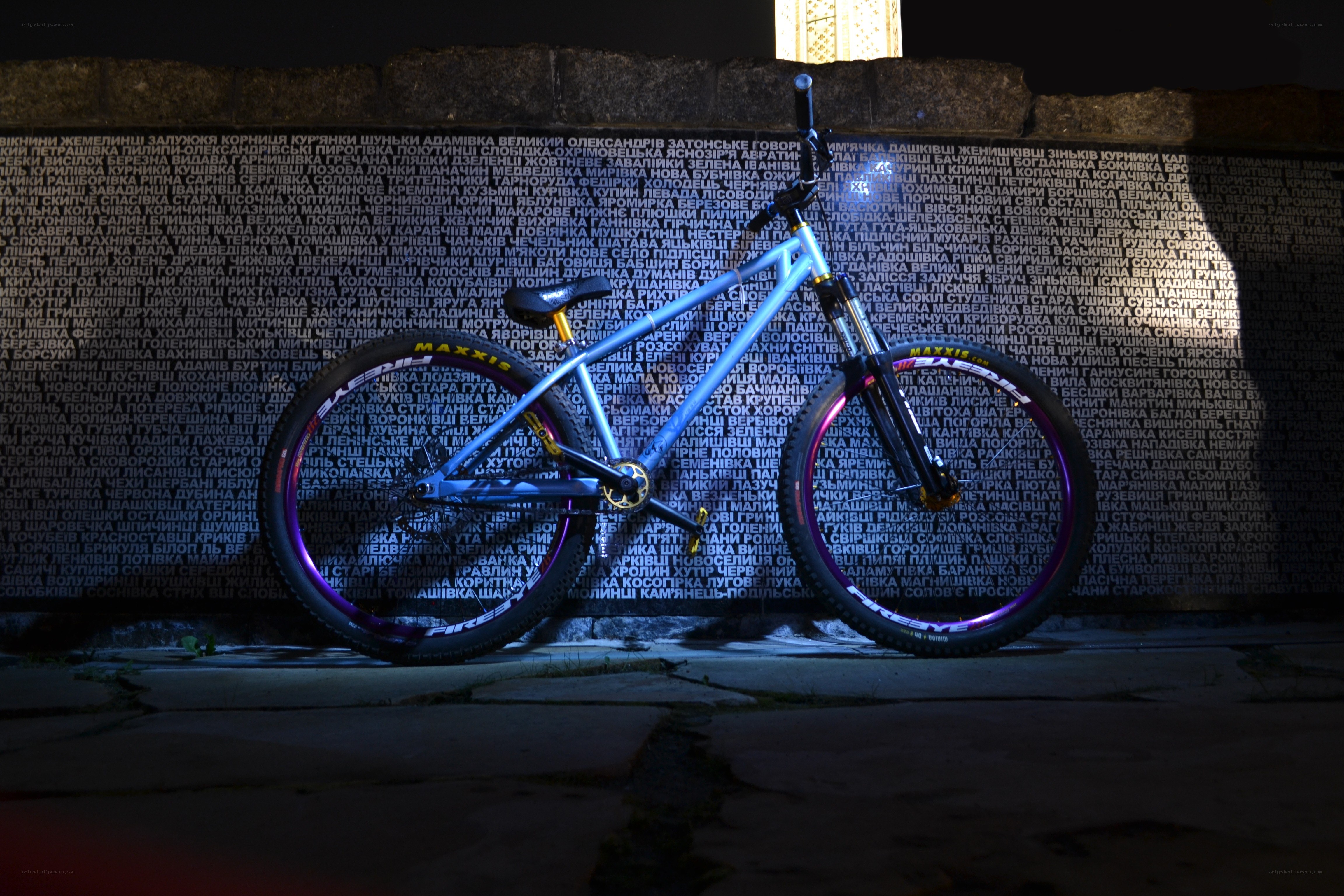 Blue mountain bike on a wall