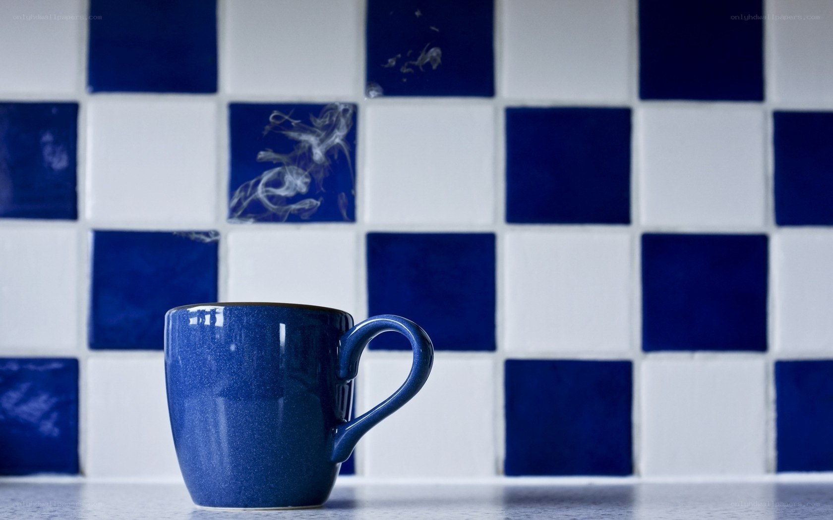 Blue mug on tiled counter