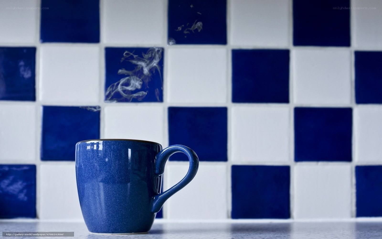 Blue mug on tiled wall