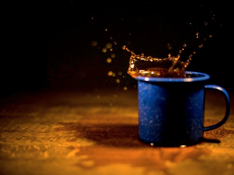 Blue Mug Splashing Coffee