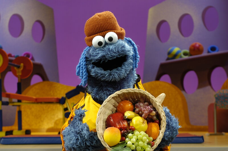 Blue Muppet Holding Fruit