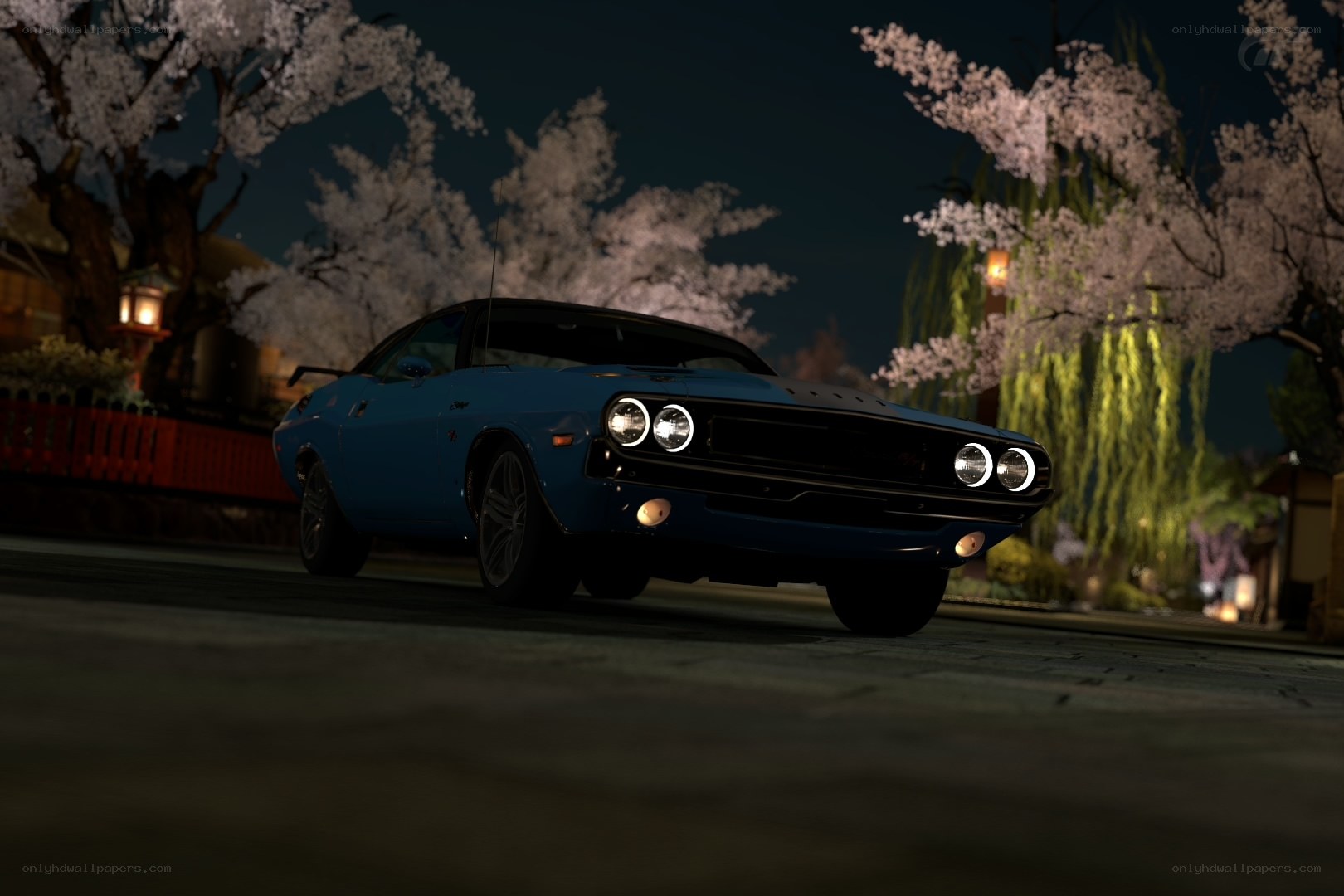 Blue muscle car at night