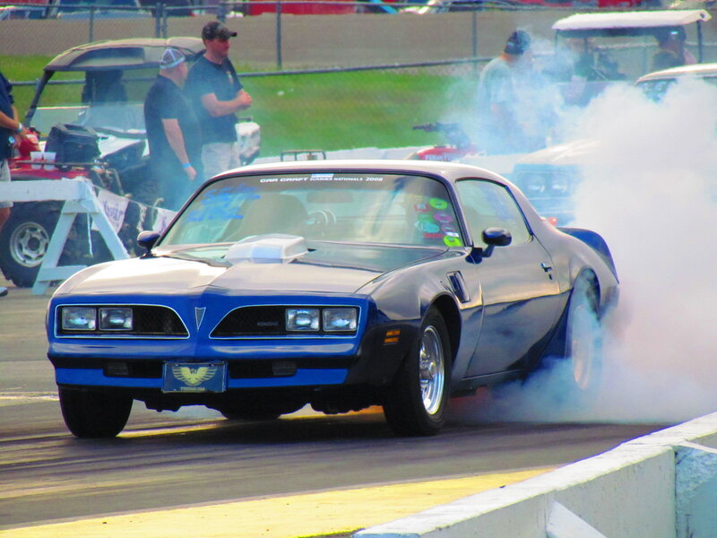 Blue Muscle Car Burning Tire