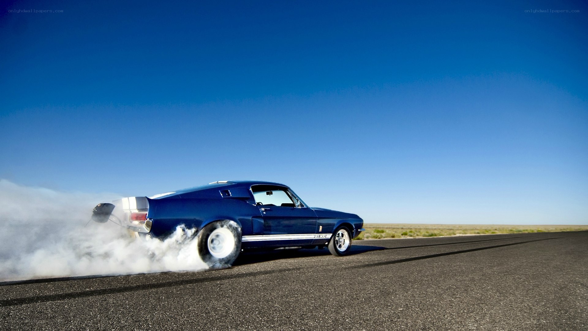 blue muscle car burnout