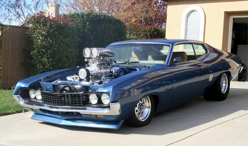 Blue Muscle Car — Calm, Afternoon, Photograph, House, Hedge