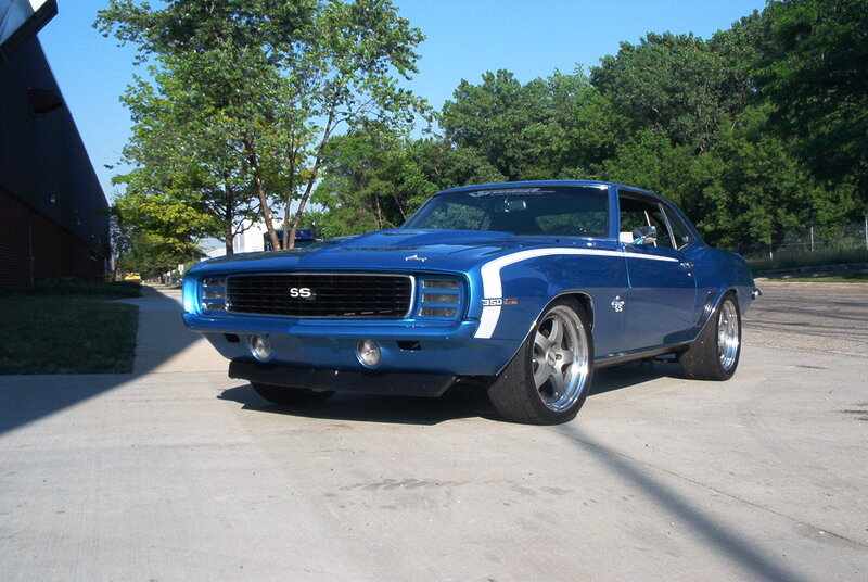 Blue Muscle Car — Calm, Afternoon, Photograph, Trees, Building