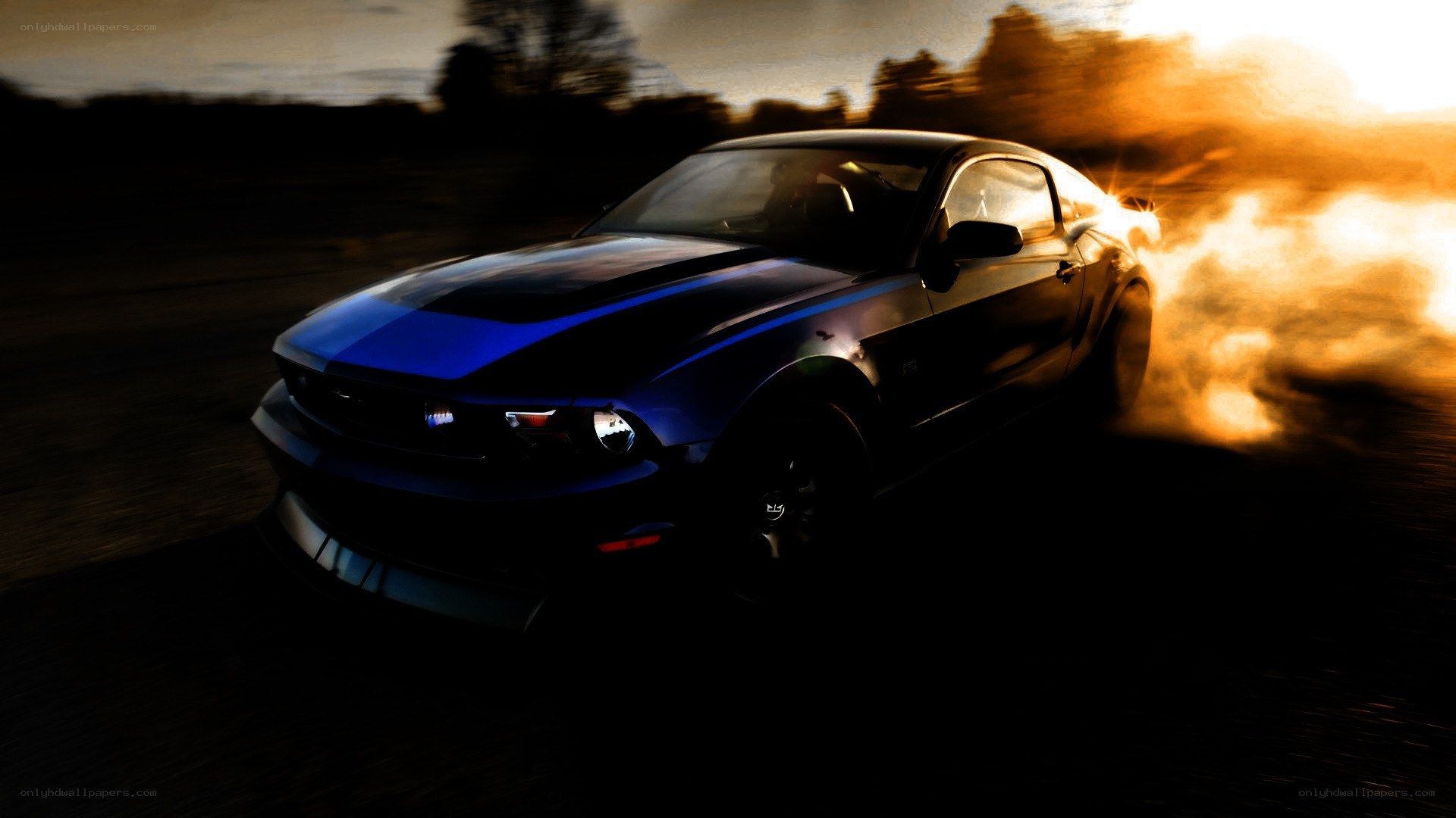 blue muscle car drifting at sunset