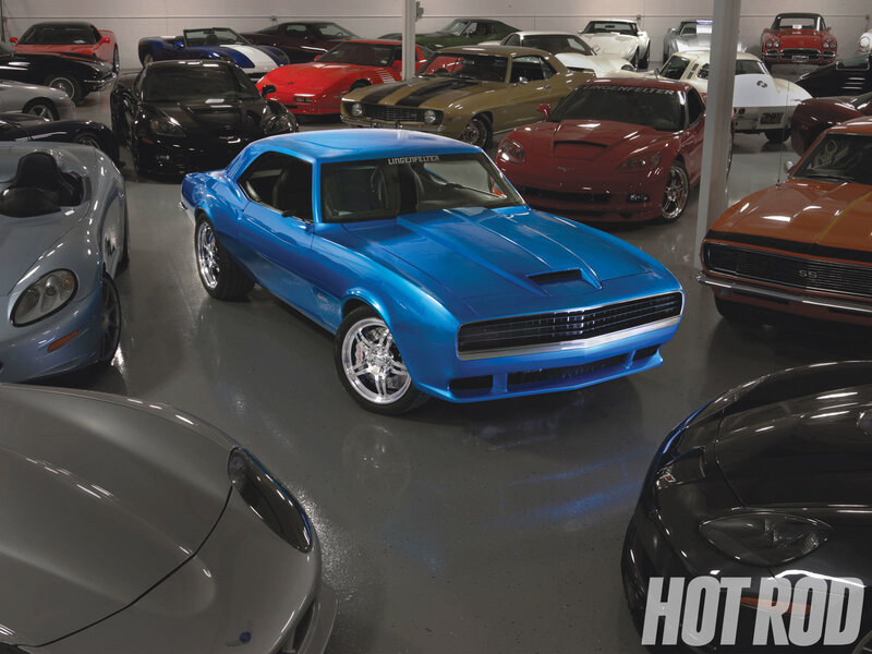 Blue muscle car in a garage