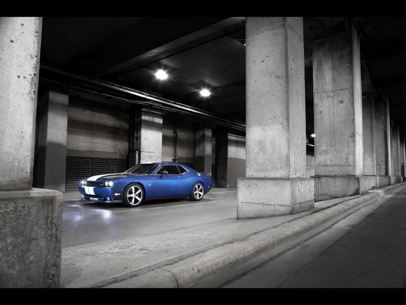 Blue muscle car in a garage