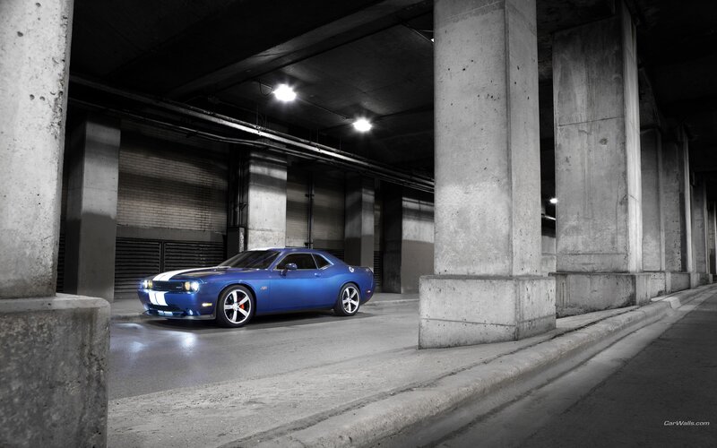 blue muscle car in garage