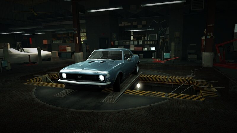 blue muscle car in garage