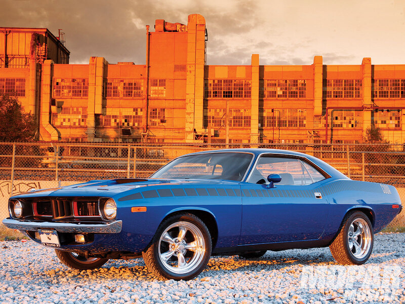 Blue muscle car in industrial setting