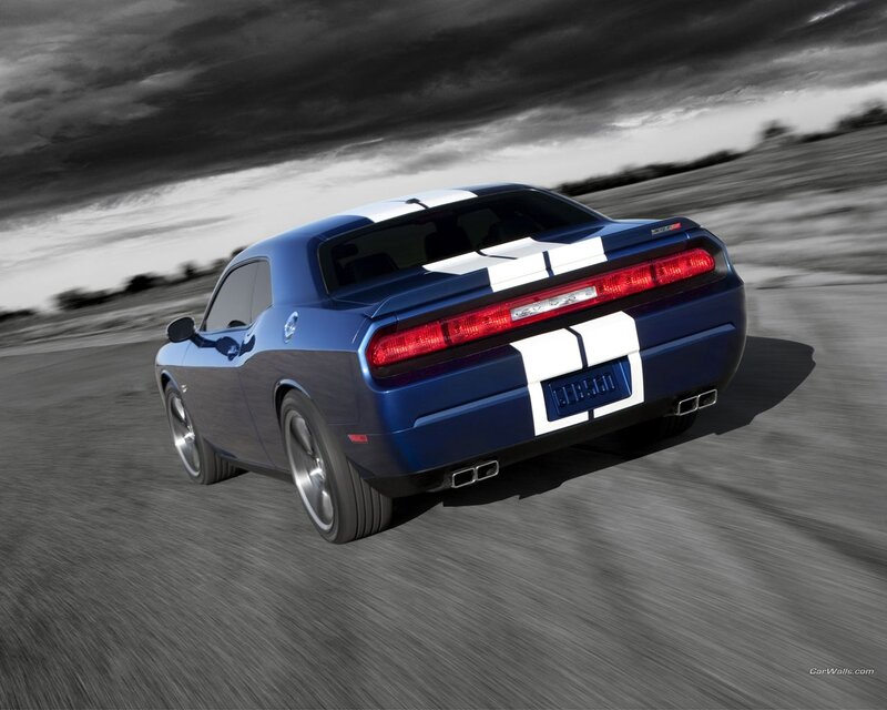 blue muscle car in motion