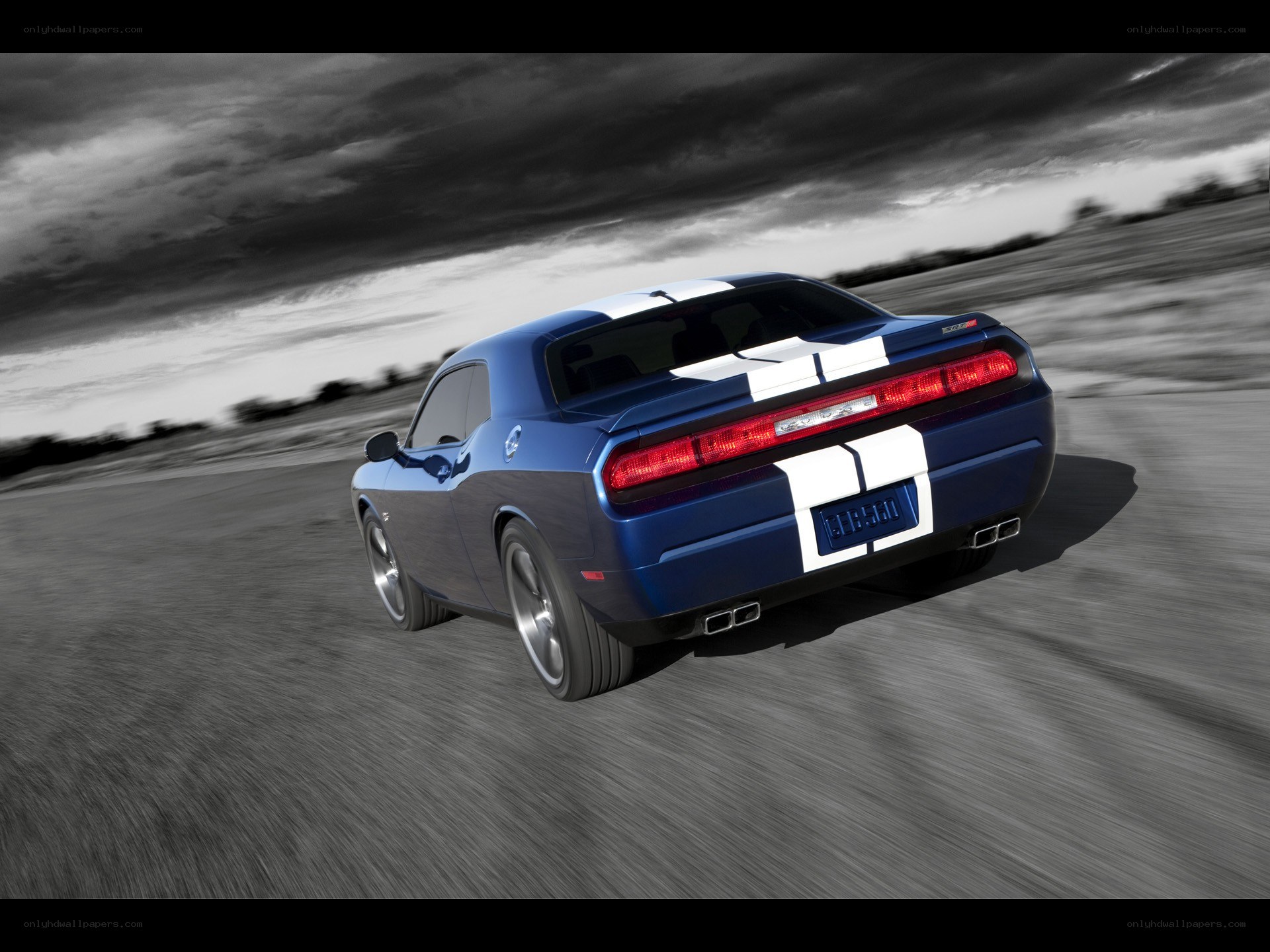 Blue muscle car in motion
