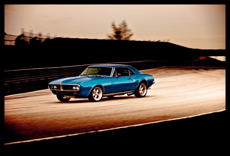 Blue muscle car on a racetrack