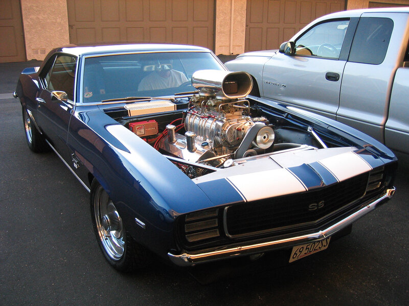 Blue muscle car with open hood