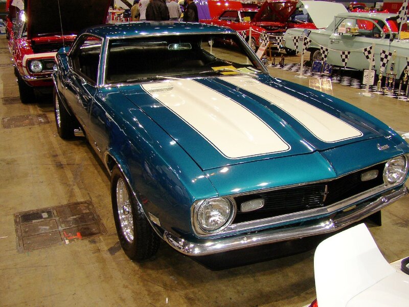 Blue muscle car with white stripes