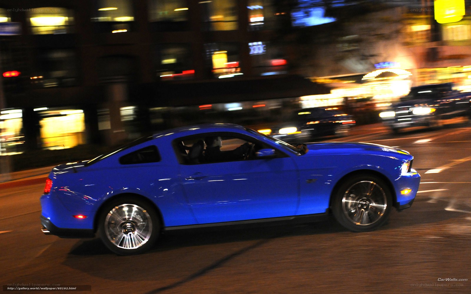 blue mustang at night