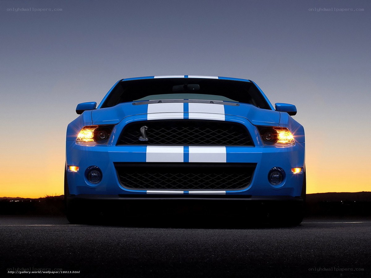 blue mustang at sunset