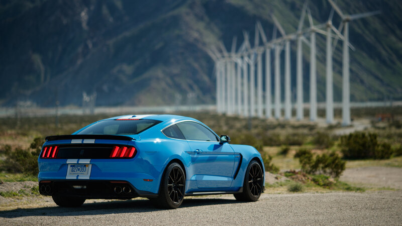 Blue Mustang Car — Dramatic, Afternoon, Photograph, Wind Turbines