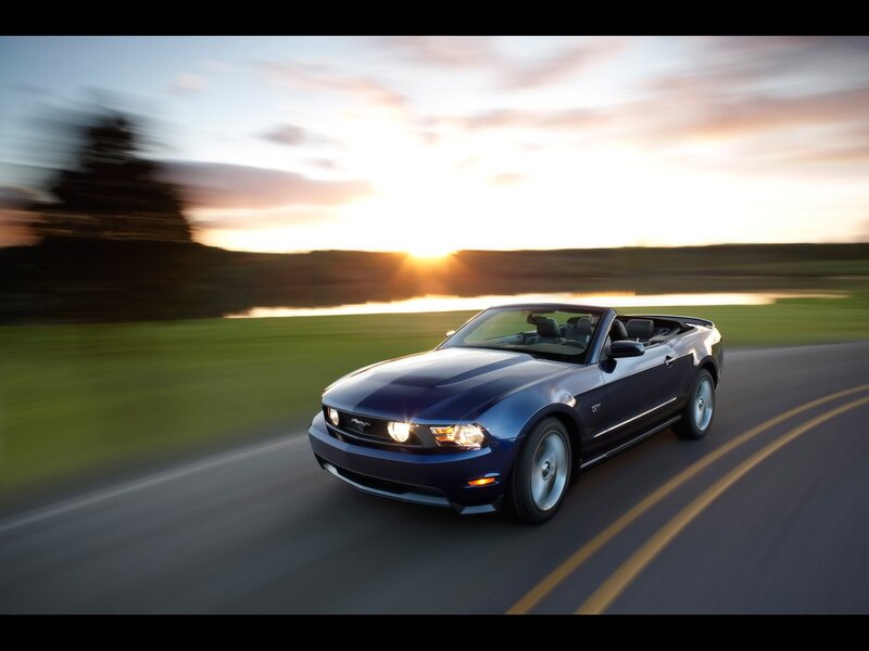 Blue Mustang convertible at sunset