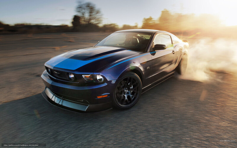 blue mustang drifts at sunset