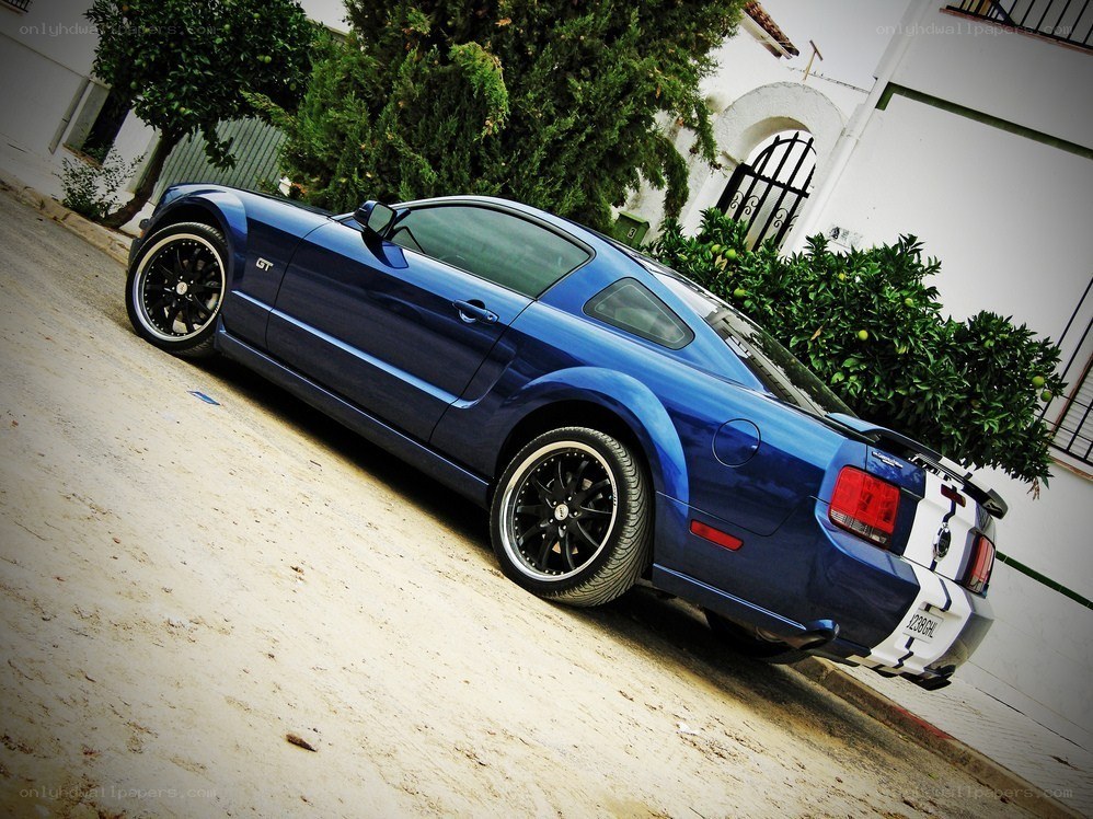 blue mustang gt parked outside