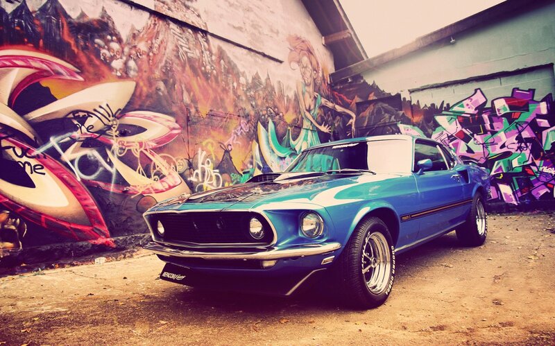 Blue Mustang in graffiti alley