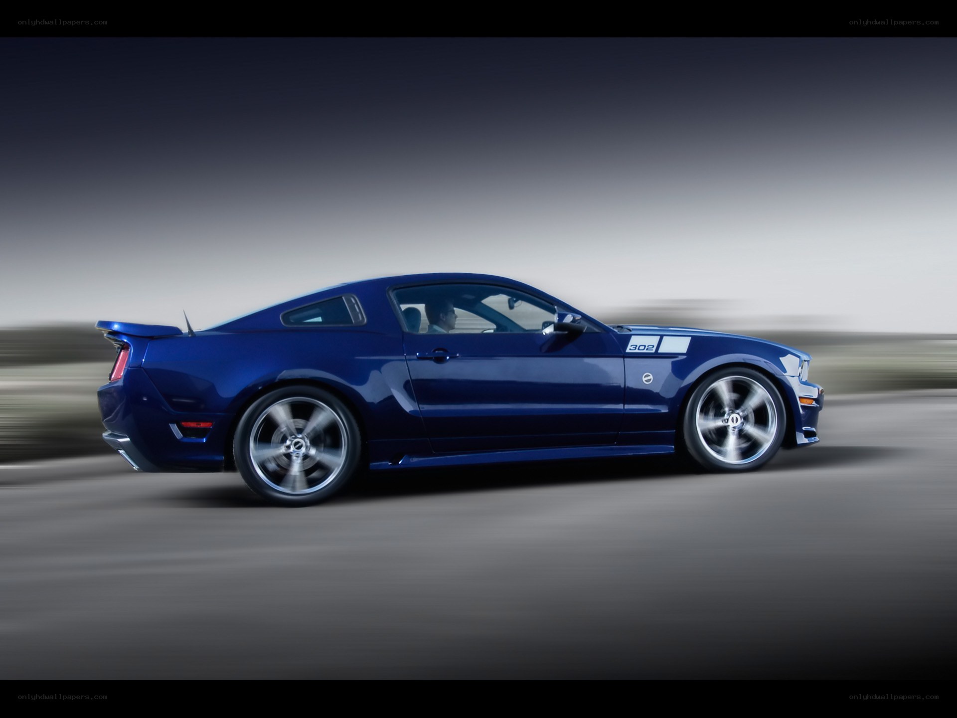 blue mustang in motion