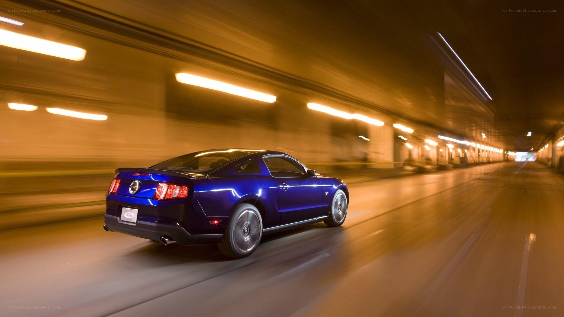 blue mustang in tunnel