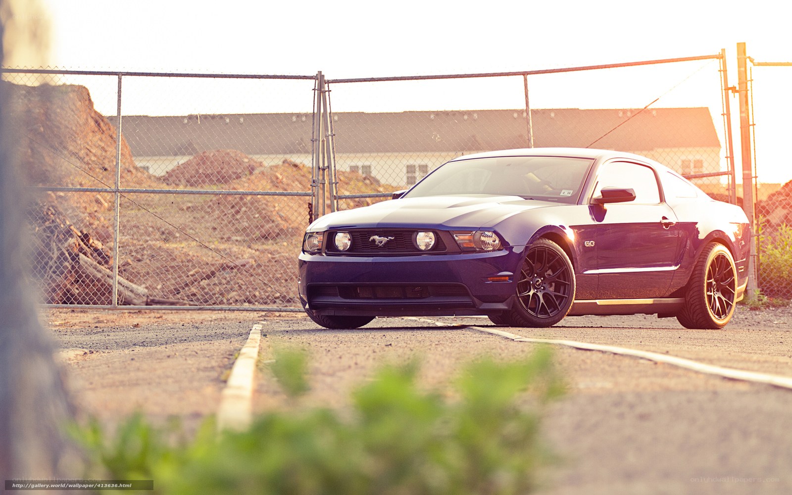 Blue Mustang on a construction site