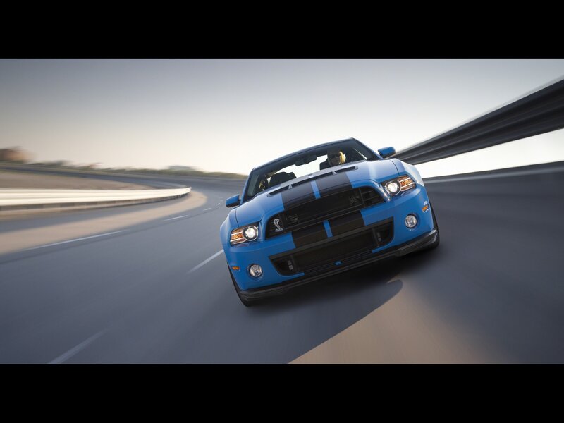 blue mustang on a racetrack