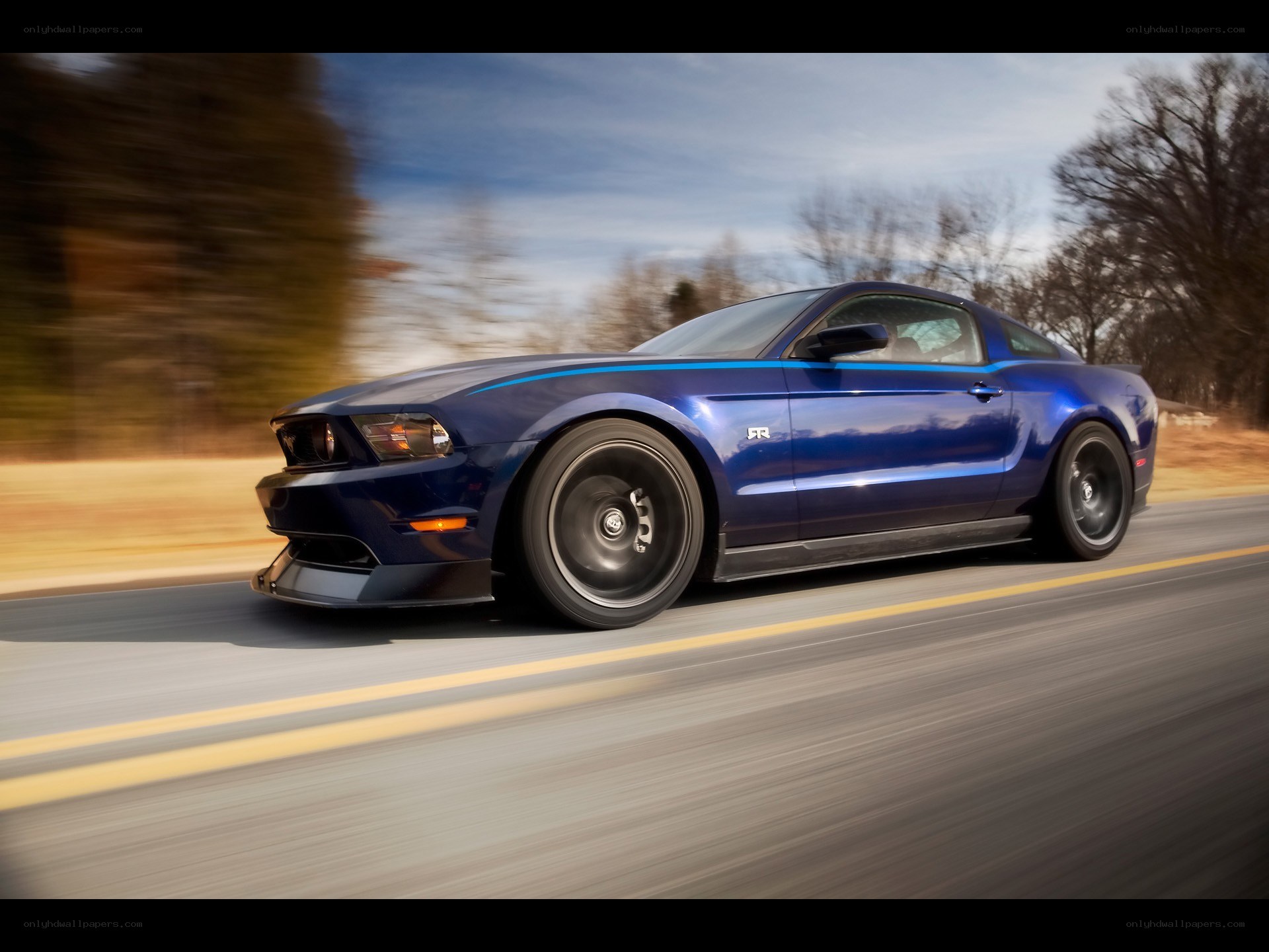 blue mustang on a road