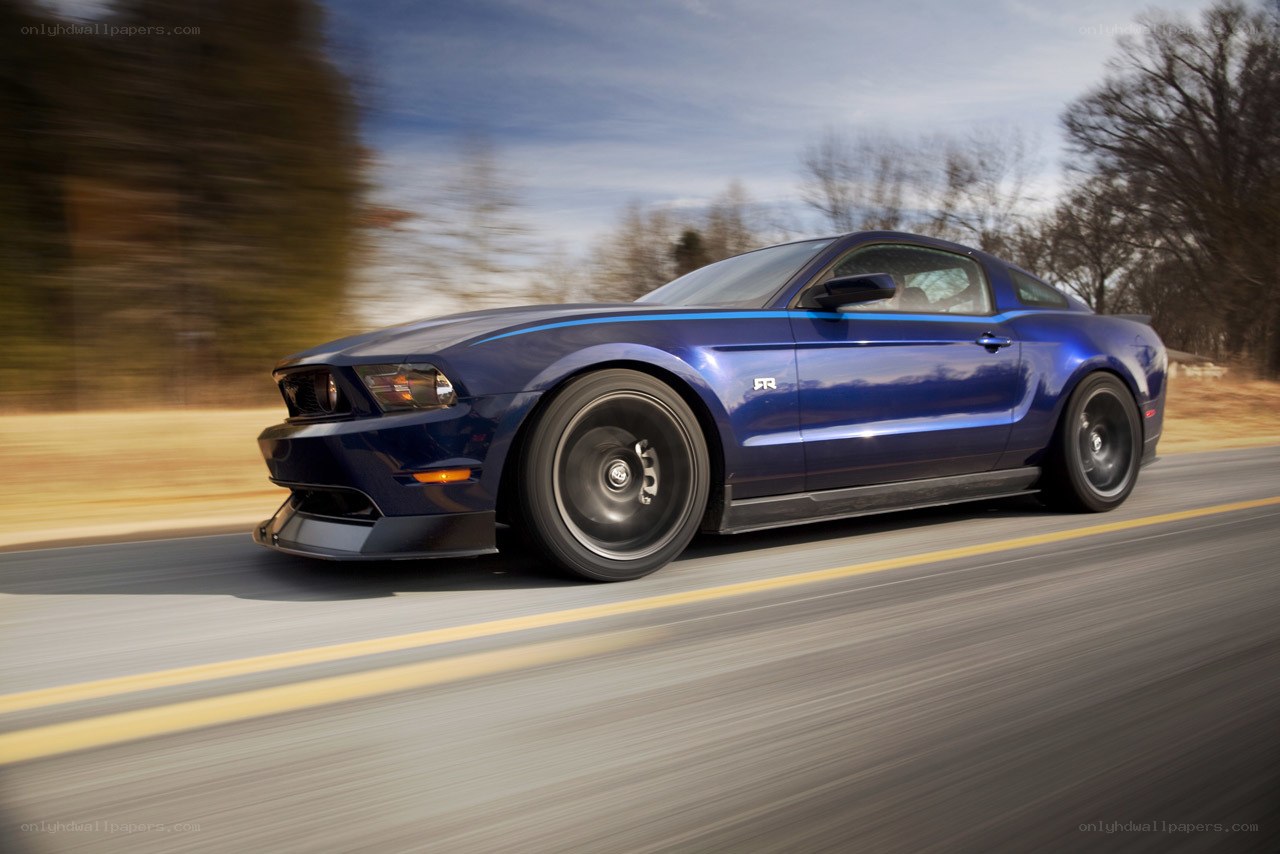 blue mustang on a road
