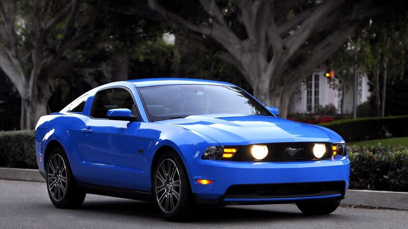 blue mustang on a street