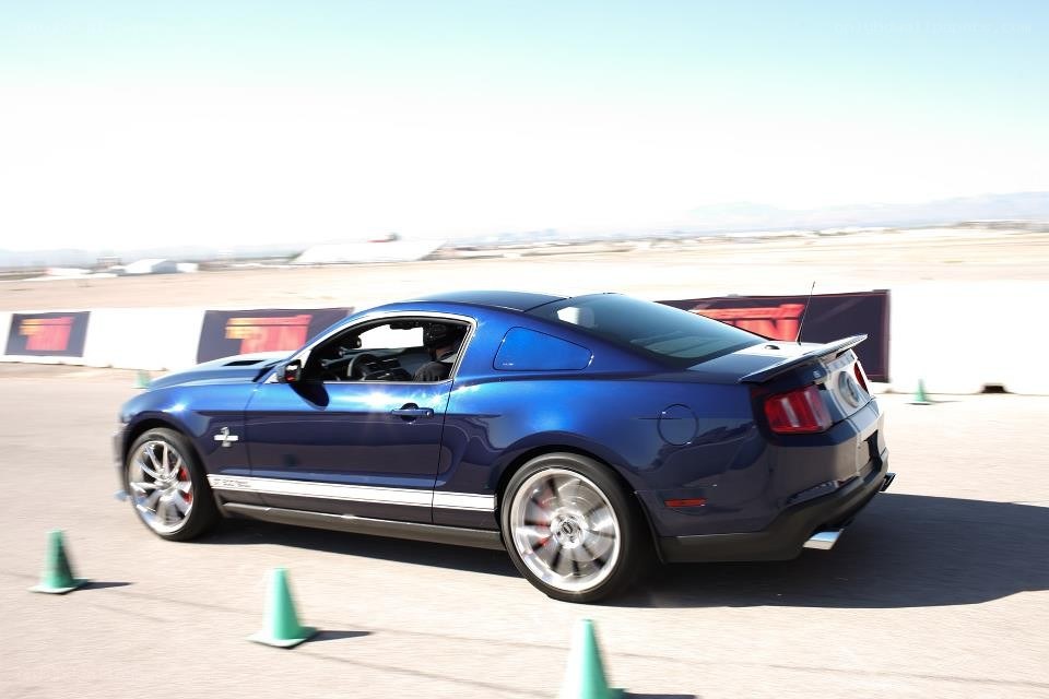 Blue Mustang on a track