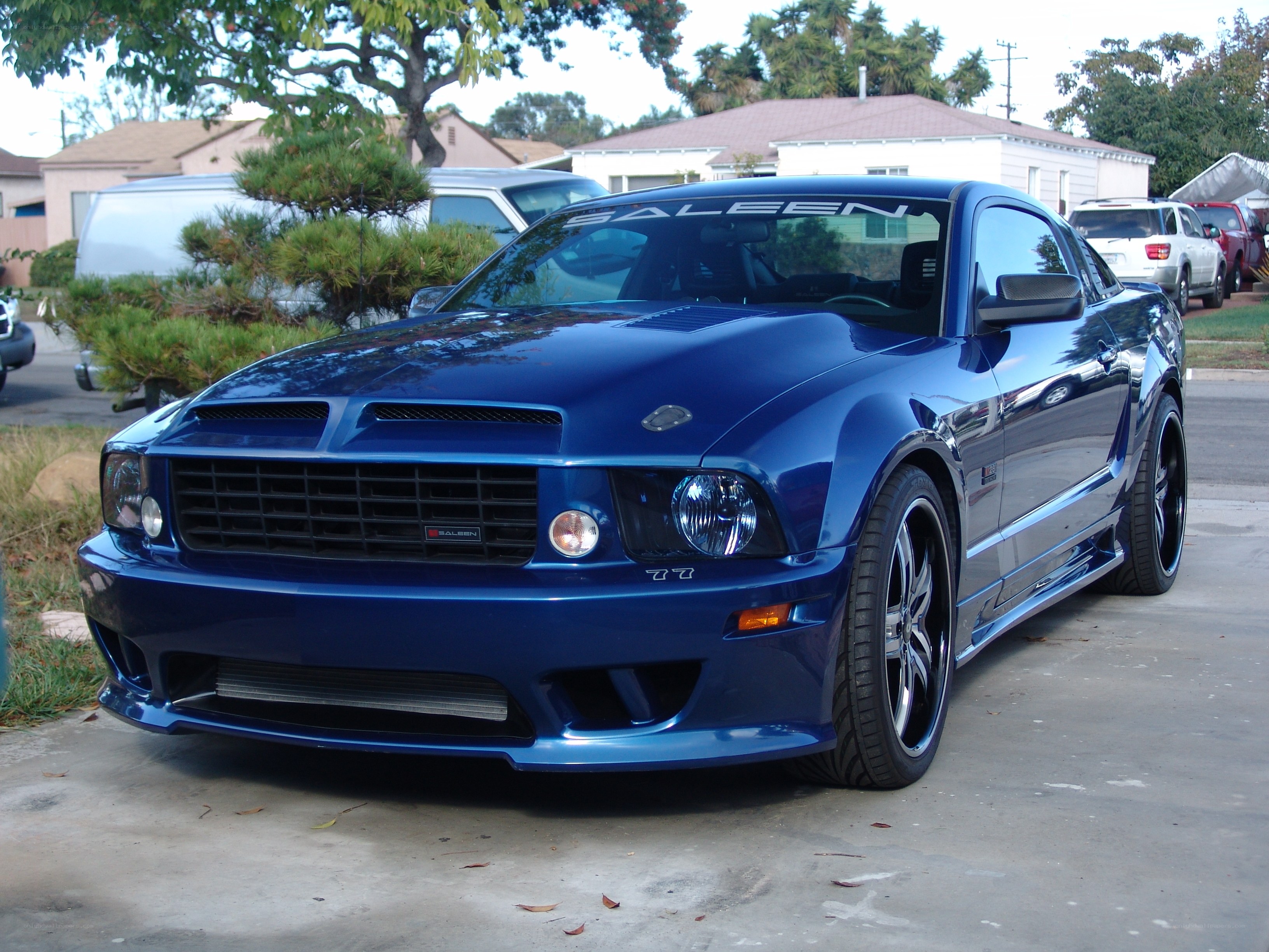 blue mustang on driveway