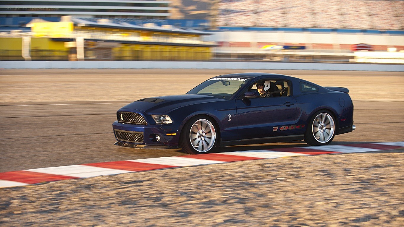 blue mustang on racetrack